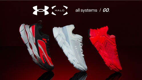 Ein schwarz-roter, ein weißer und ein roter Schuh von Under Armour